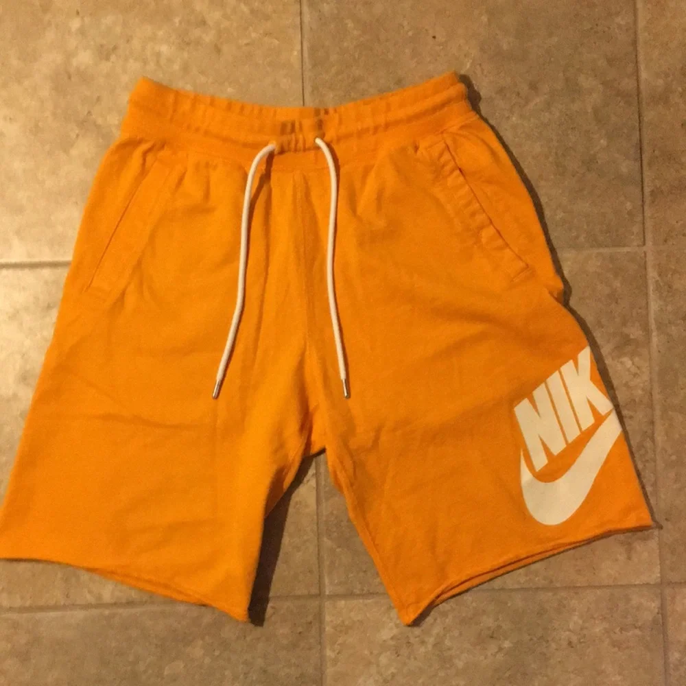 Nike Orange Men's Athletic Shorts with White Logo
